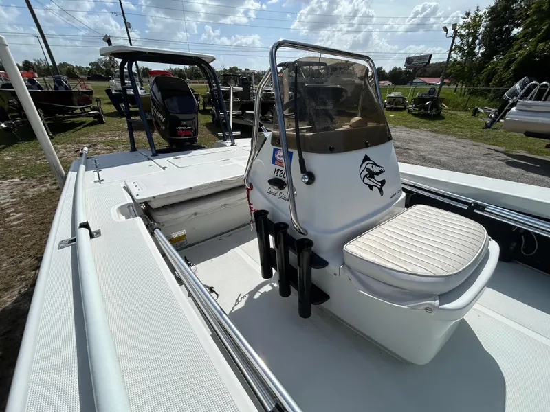 Slide: The Image of 1998 Action Craft 1820 Special Edition boat interior with console and seating. - 8