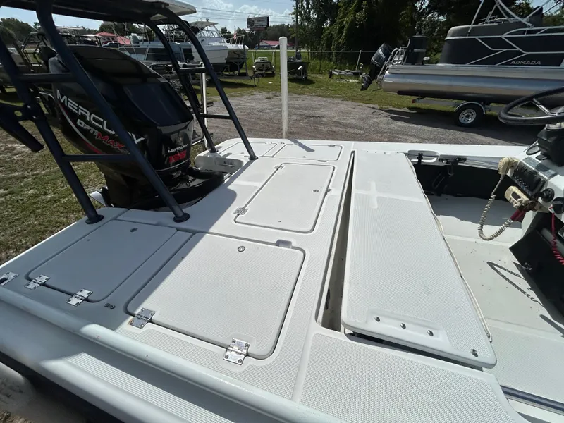 Slide: The Image of 1998 Action Craft 1820 Special Edition boat with Mercury outboard motor, docked outdoors. - 9