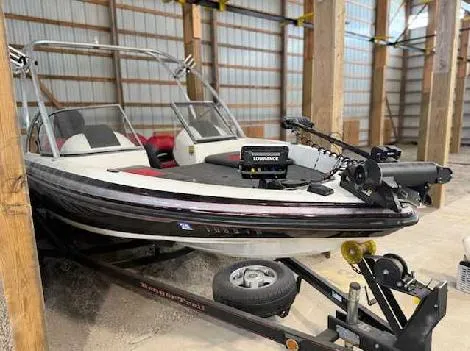 Slide: The Image of 2009 Ranger 211 Reata boat stored indoors on a trailer. - 1