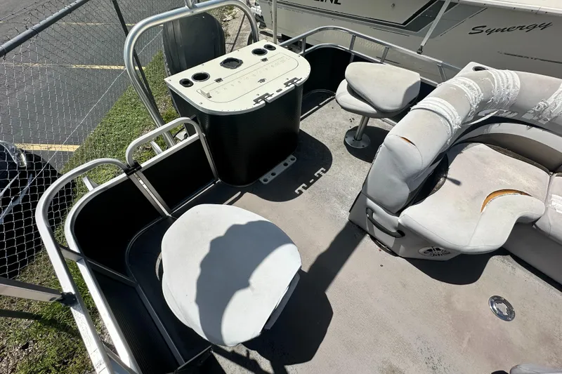 Slide: The Image of 2016 Qwest LS 820 Cruise boat interior with worn seating and control panel. - 15
