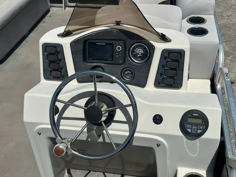 Slide: The Image of Steering console of 2016 Qwest LS 820 Cruise boat with controls and gauges. - 16