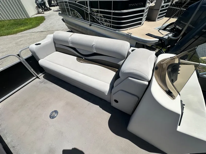 Slide: The Image of 2016 Qwest LS 820 Cruise boat interior with beige seating and console. - 17
