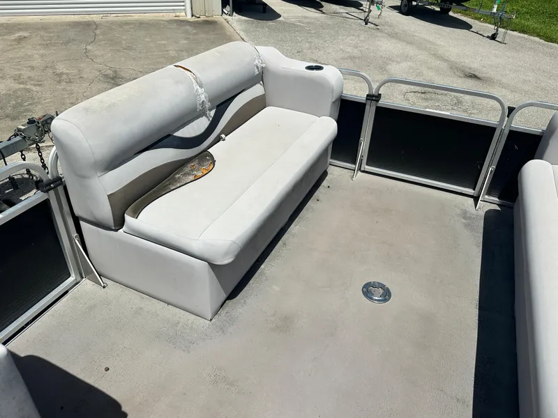 Slide: The Image of 2016 Qwest LS 820 Cruise boat interior with white seating and metal railings. - 18