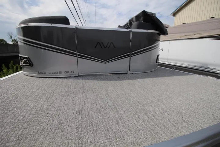 Slide: The Image of 2025 Avalon LSZ QUAD LOUNGER SHIFT pontoon boat with sleek design and spacious deck. - 1