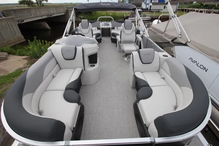 Slide: The Image of 2025 Avalon LSZ Quad Lounger Shift pontoon boat with luxurious seating and modern design. - 11