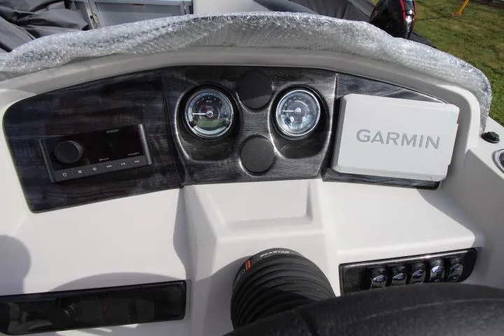 Slide: The Image of Dashboard of 2025 Avalon LSZ Quad Lounger Shift with Garmin navigation system. - 5