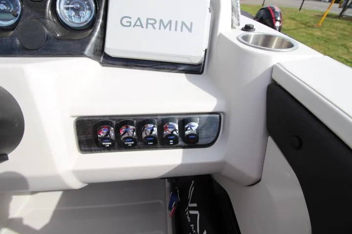 Slide: The Image of Control panel of 2025 Avalon LSZ Quad Lounger Shift with Garmin display and switches. - 6