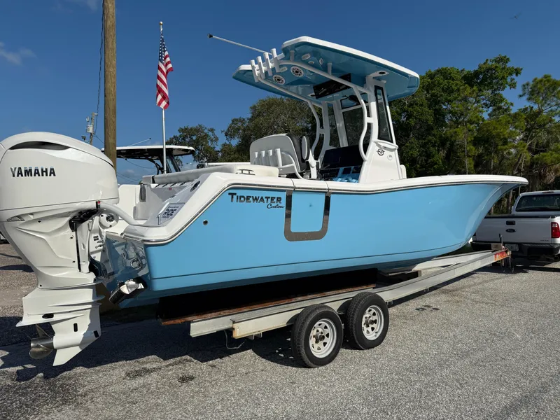 The Image of 2026 Tidewater 256 LXF boat on trailer with Yamaha engine, parked outdoors. - 0