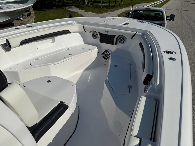 Slide: The Image of 2026 Tidewater 256 LXF boat interior with seating and storage compartments. - 5