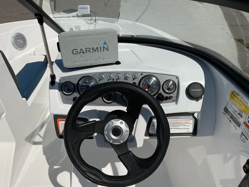 Slide: The Image of Steering console of 2023 Tahoe 185 S boat with Garmin navigation system. - 11