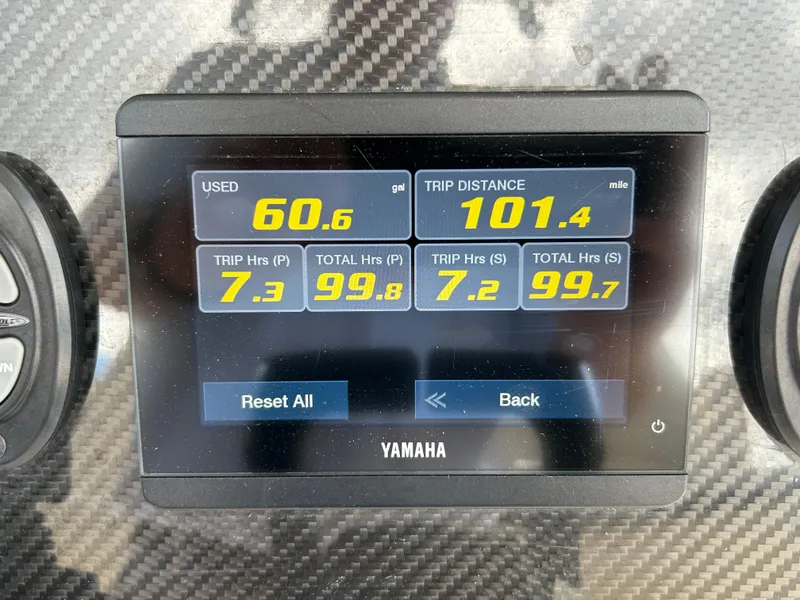 Slide: The Image of Yamaha display showing fuel usage and trip data on 2023 Grady-White 281 Coastal Explorer. - 10