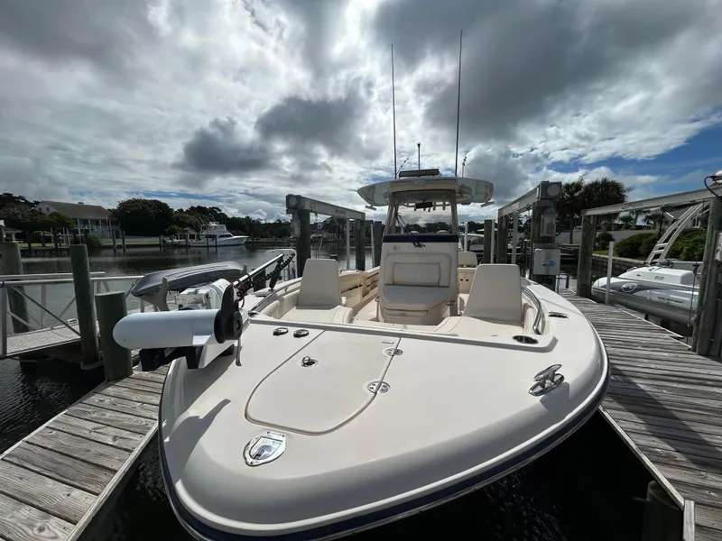 Slide: The Image of 2023 Grady-White 281 Coastal Explorer boat docked under cloudy sky. - 15