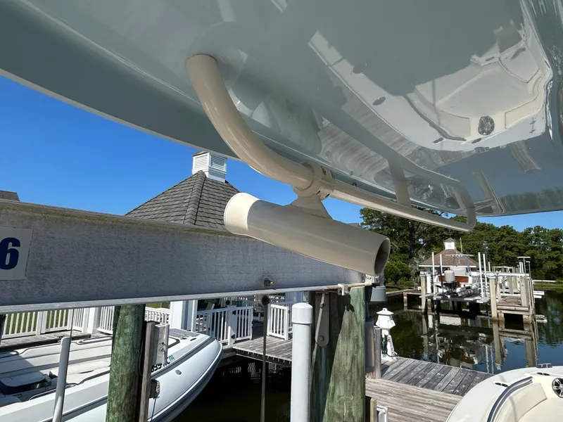 Slide: The Image of 2023 Grady-White 281 Coastal Explorer docked, showcasing underside and marina setting. - 18