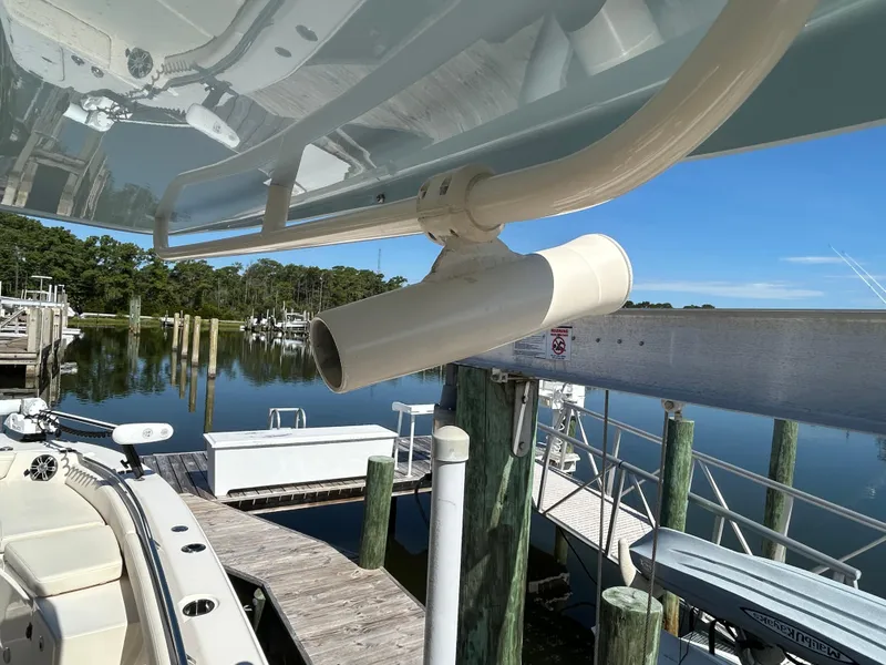 Slide: The Image of 2023 Grady-White 281 Coastal Explorer docked, showcasing boat details and serene marina setting. - 19