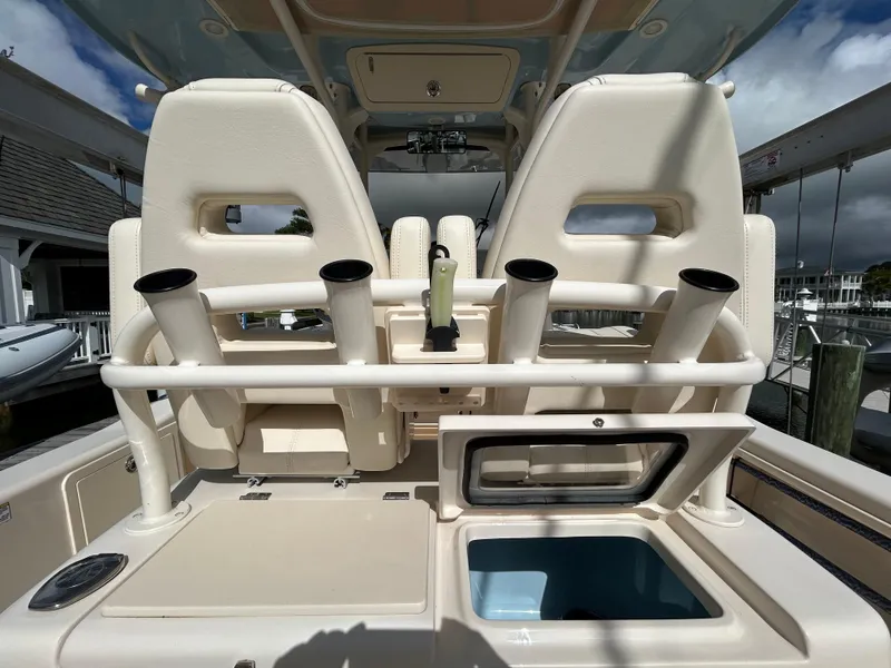 Slide: The Image of 2023 Grady-White 281 Coastal Explorer boat interior with rod holders and storage compartments. - 6