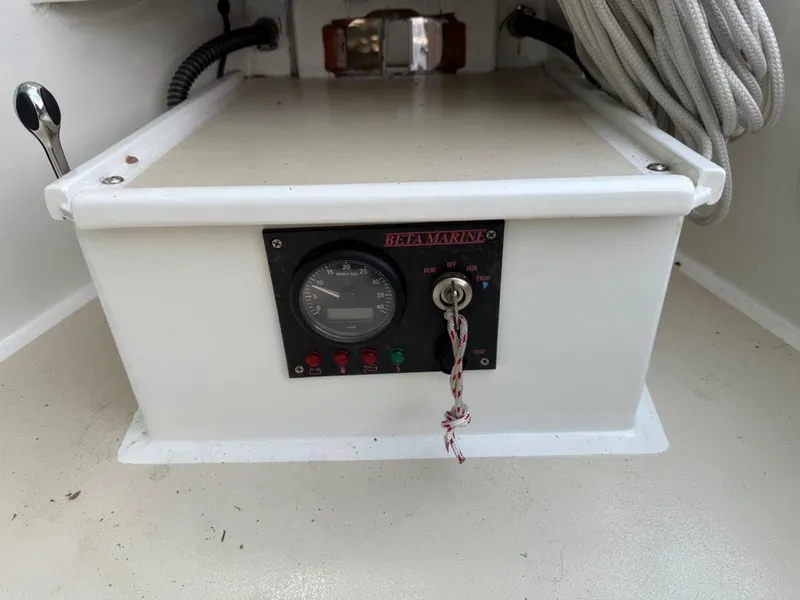 Slide: The Image of Control panel of AREY's XFC-22 boat, featuring Beta Marine gauge and ignition switch. - 12