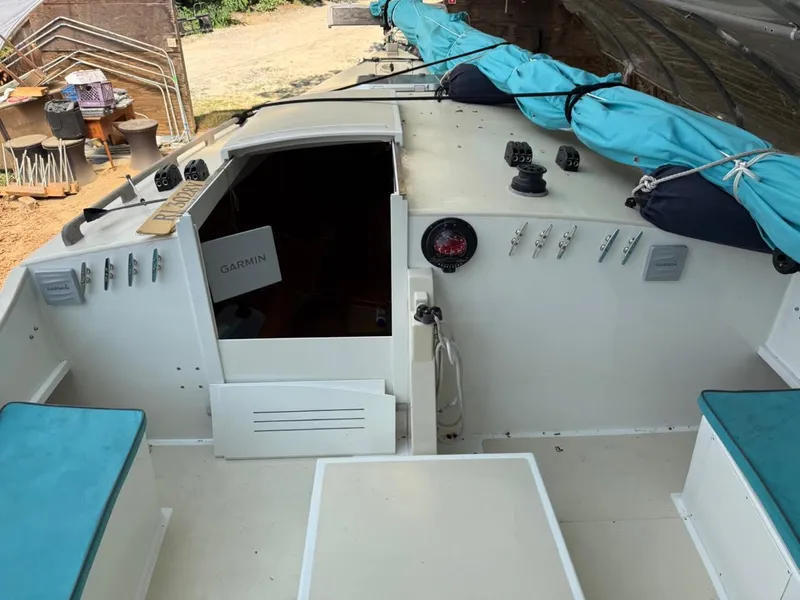 Slide: The Image of Cockpit of 2022 AREY's XFC-22 sailboat with Garmin equipment and blue sail cover. - 13