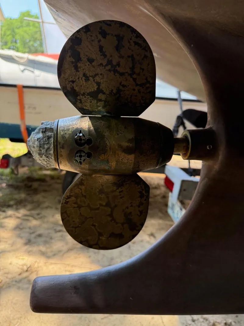 Slide: The Image of Close-up of a weathered propeller on a 2022 AREY's XFC-22 boat. - 17