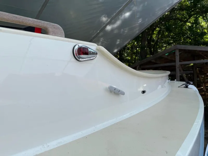 Slide: The Image of Custom AREY's XFC-22 boat, 2022 model, featuring sleek white design and red light detail. - 22