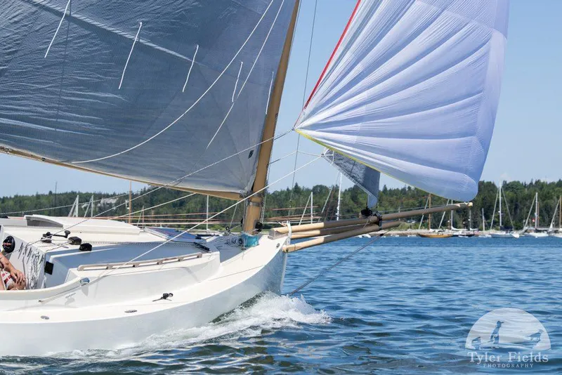 Slide: The Image of Sailing yacht AREY's XFC-22 gliding on water, vibrant sails, clear sky, 2022 model. - 6