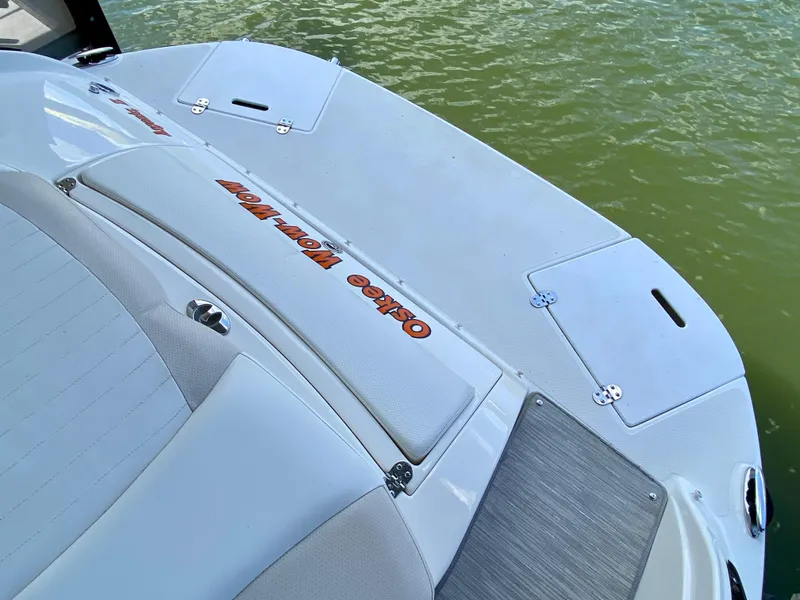 Slide: The Image of 2008 Rinker 246 Captiva Bowrider boat deck on calm water. - 14