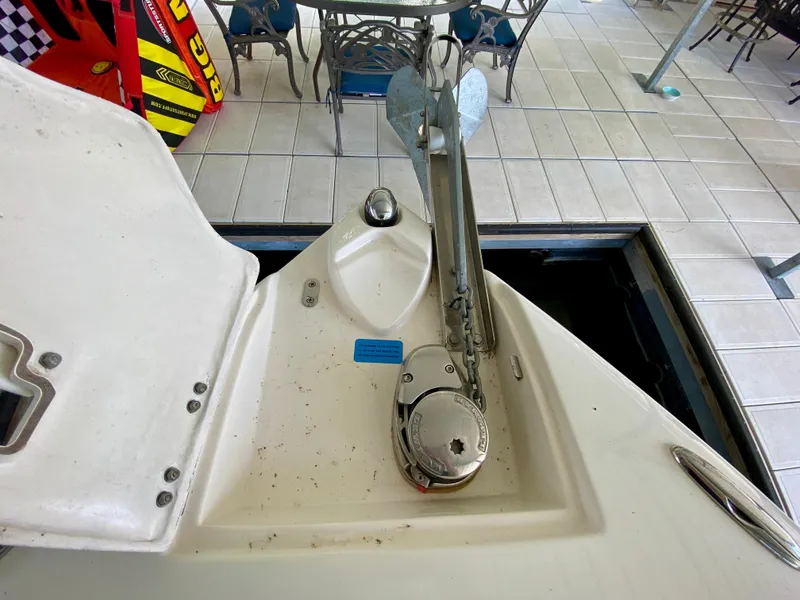 Slide: The Image of 2008 Rinker 246 Captiva Bowrider anchor system on tiled dock. - 22