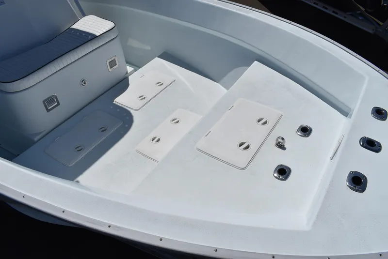 Slide: The Image of 2006 Cape Horn 27 CC boat deck with seating and storage compartments. - 10