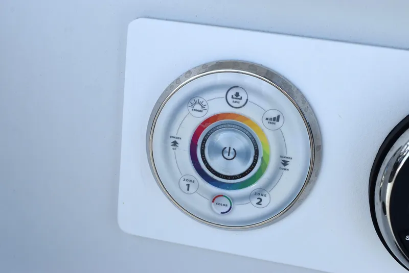 Slide: The Image of Control panel on a 2006 Cape Horn 27 CC boat, featuring color and dimmer settings. - 17