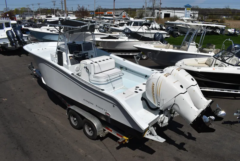 Slide: The Image of 2006 Cape Horn 27 CC boat on trailer, surrounded by other boats in a dealership lot. - 3