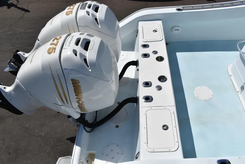 Slide: The Image of 2006 Cape Horn 27 CC boat with twin Mercury 275 engines, featuring a spacious deck layout. - 5