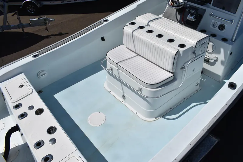 Slide: The Image of 2006 Cape Horn 27 CC boat interior with white seating and control panel. - 6