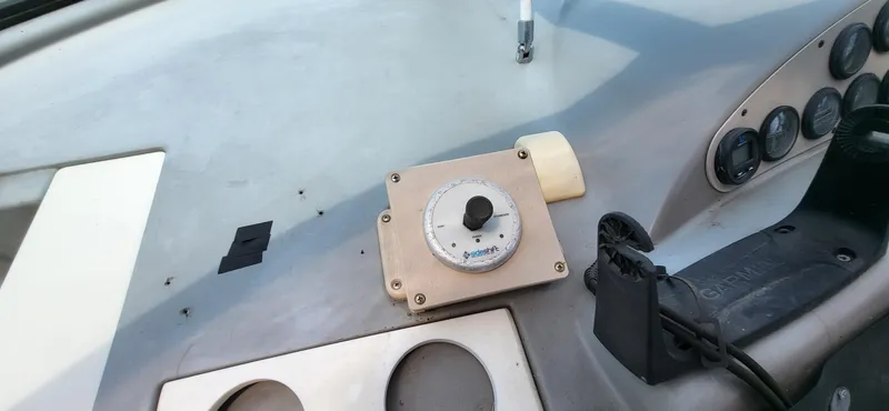 Slide: The Image of Dashboard of a 2000 Carver 350 Mariner boat with control panel and gauges. - 17