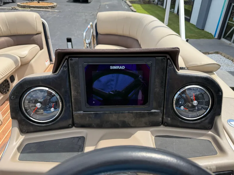 Slide: The Image of Dashboard of 2018 SunCatcher Elite 322 RC boat with Simrad display and gauges. - 16