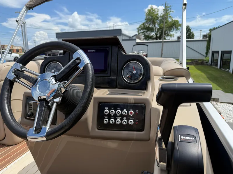 Slide: The Image of Steering console of 2018 SunCatcher Elite 322 RC boat with Yamaha controls. - 17