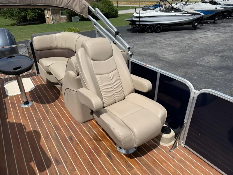 Slide: The Image of Luxurious seating on 2018 SunCatcher Elite 322 RC pontoon boat with wood-style flooring. - 19