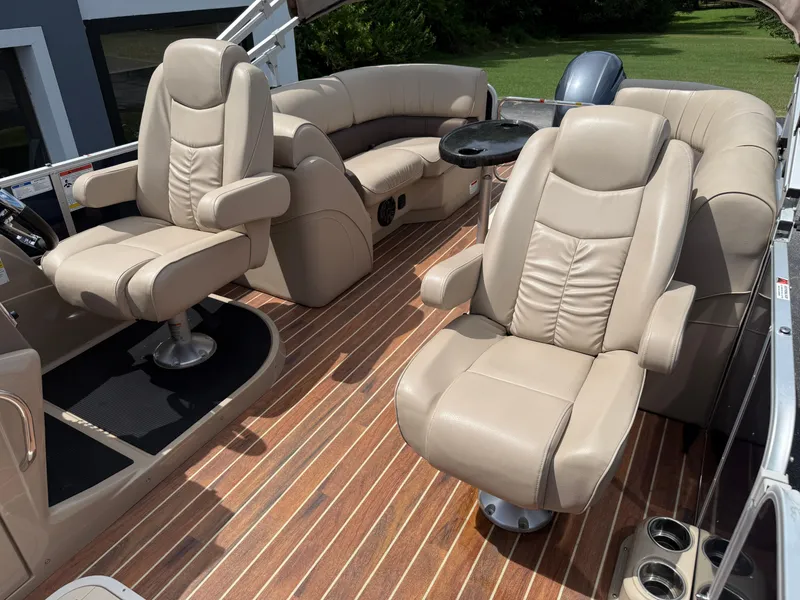 Slide: The Image of Luxurious 2018 SunCatcher Elite 322 RC boat interior with plush seating and wood flooring. - 20