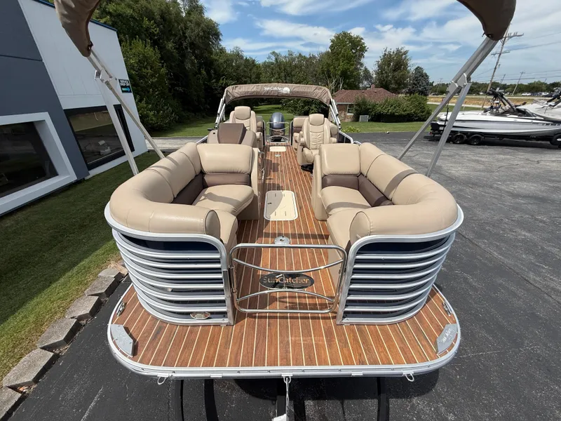 Slide: The Image of 2018 SunCatcher Elite 322 RC pontoon boat with spacious seating and elegant design. - 8