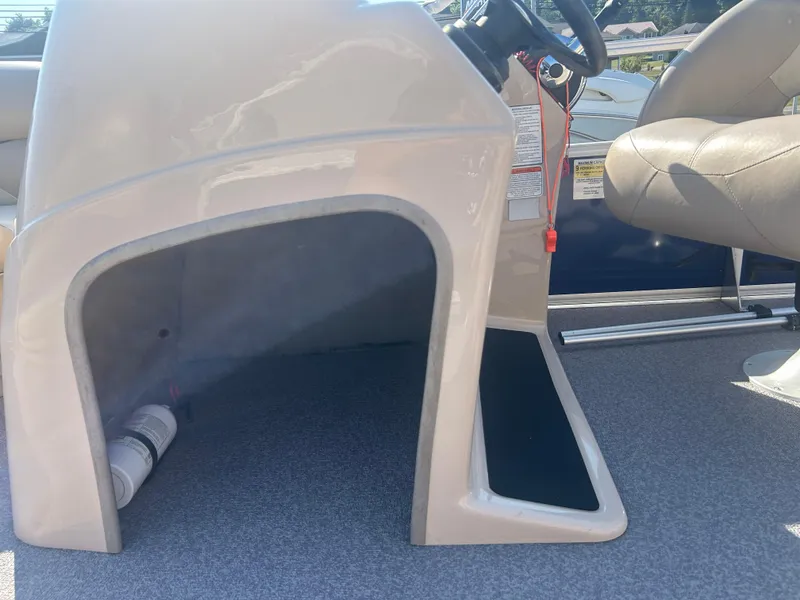 Slide: The Image of 2016 Sun Tracker Party Barge 18 DLX interior with steering console and seating. - 16