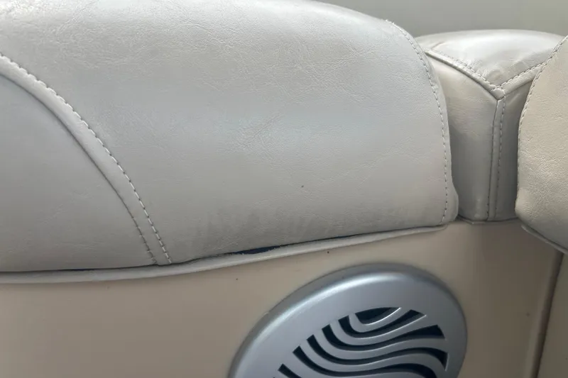 Slide: The Image of Close-up of 2016 Sun Tracker Party Barge 18 DLX seat and speaker detail. - 17