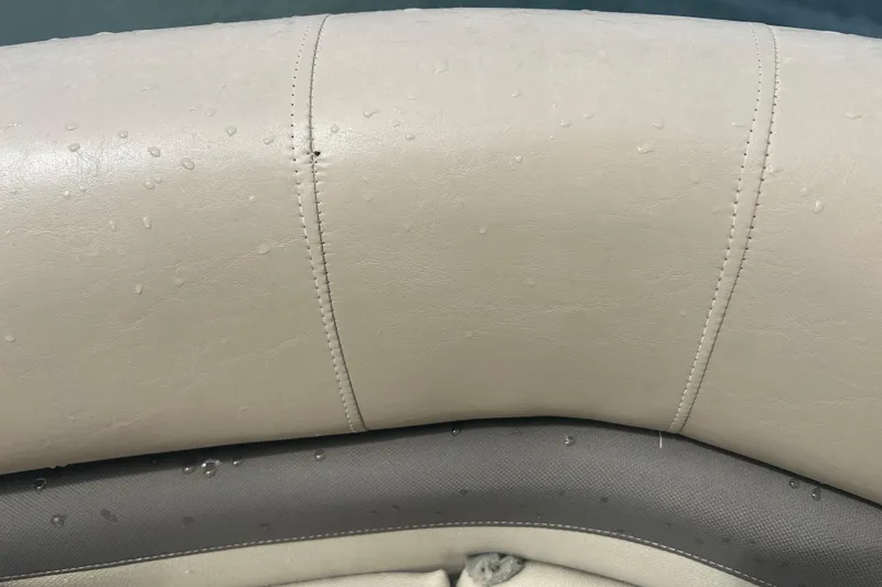 Slide: The Image of Close-up of wet beige upholstery on 2016 Sun Tracker Party Barge 18 DLX. - 19