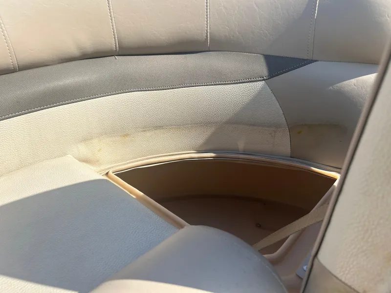 Slide: The Image of 2016 Sun Tracker Party Barge 18 DLX interior seating with storage compartment. - 23