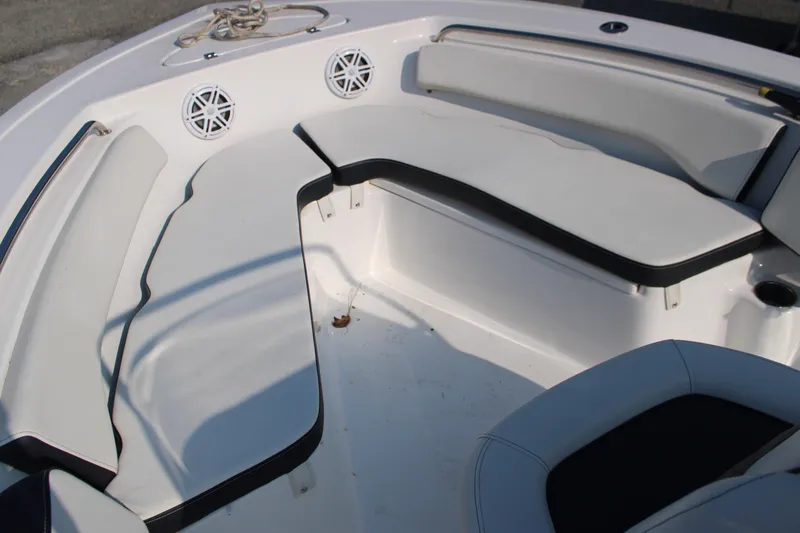 Slide: The Image of 2021 Tidewater 198 CC Adventure boat interior with cushioned seating and speakers. - 11
