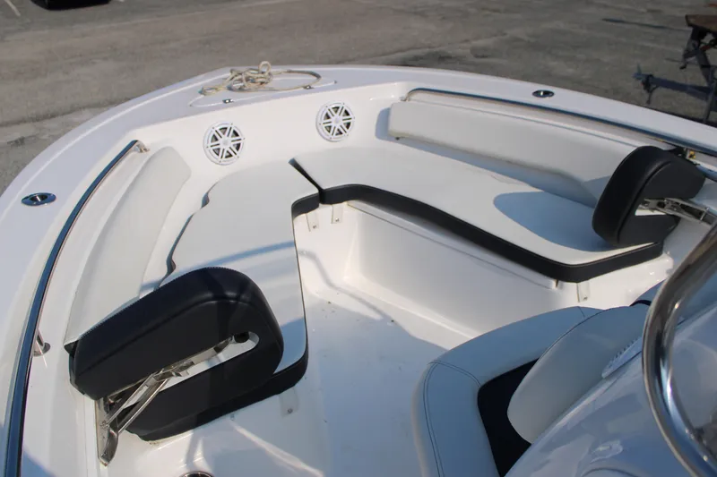 Slide: The Image of 2021 Tidewater 198 CC Adventure boat interior with cushioned seating and speakers. - 12