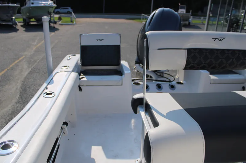 Slide: The Image of 2021 Tidewater 198 CC Adventure boat interior with seating and rod holders. - 15