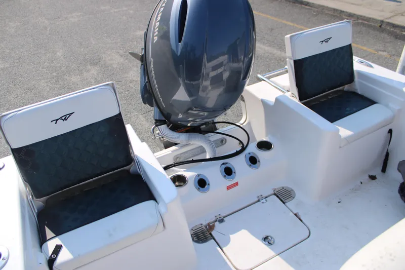 Slide: The Image of 2021 Tidewater 198 CC Adventure boat with dual seats and Yamaha outboard motor. - 16