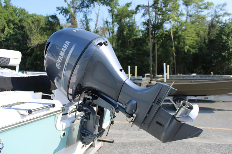 Slide: The Image of Outboard motor on 2021 Tidewater 198 CC Adventure boat, parked outdoors. - 17