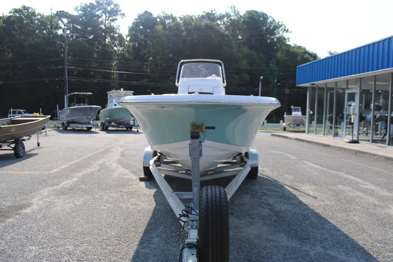 Slide: The Image of 2021 Tidewater 198 CC Adventure boat on trailer at dealership. - 2
