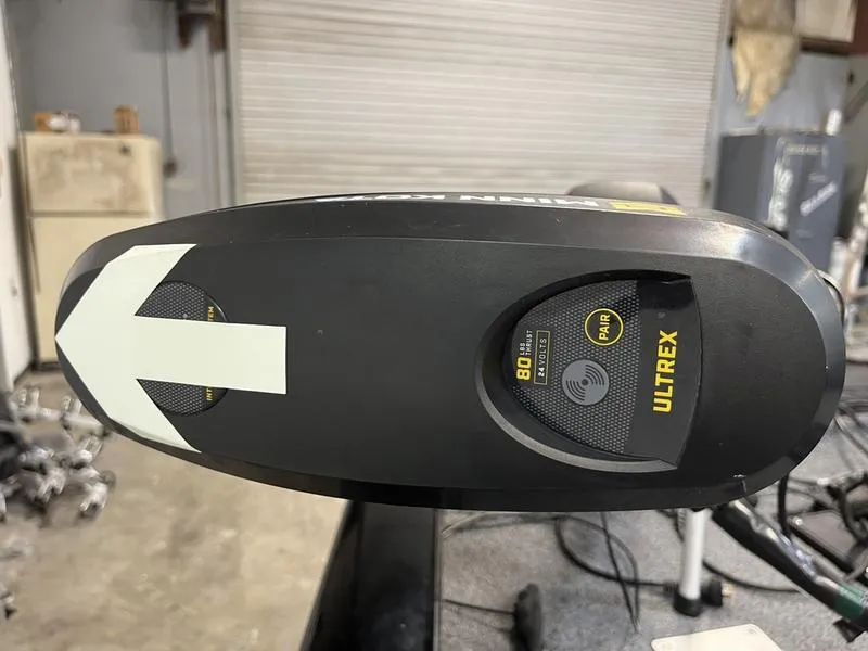 Slide: The Image of Trolling motor on 2020 Tracker Pro Team 195 TXW boat in a garage setting. - 13