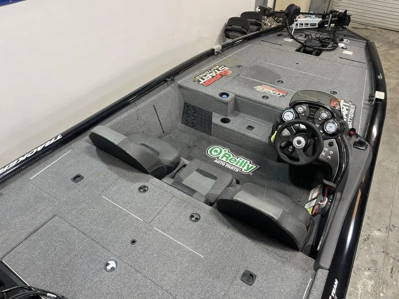 Slide: The Image of 2020 Tracker Pro Team 195 TXW boat interior with steering console and seating. - 5