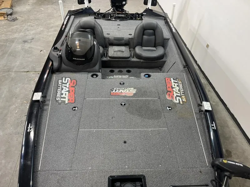 Slide: The Image of 2020 Tracker Pro Team 195 TXW boat interior with dual seats and Super Start Batteries branding. - 6